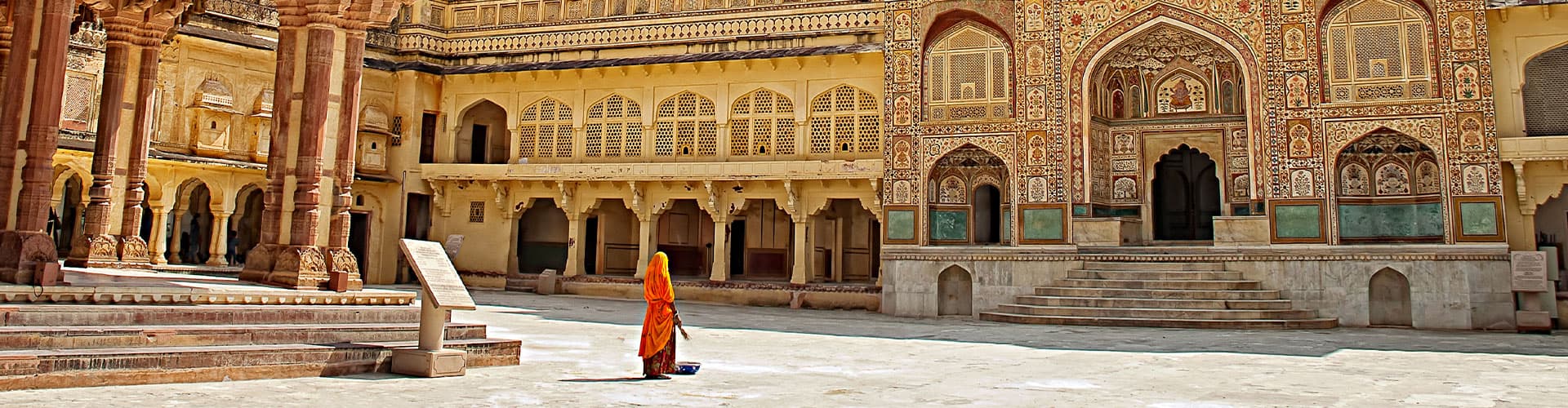 HHPHC - Persona walking through decorative gate of Amber Fort in Jaipur, India