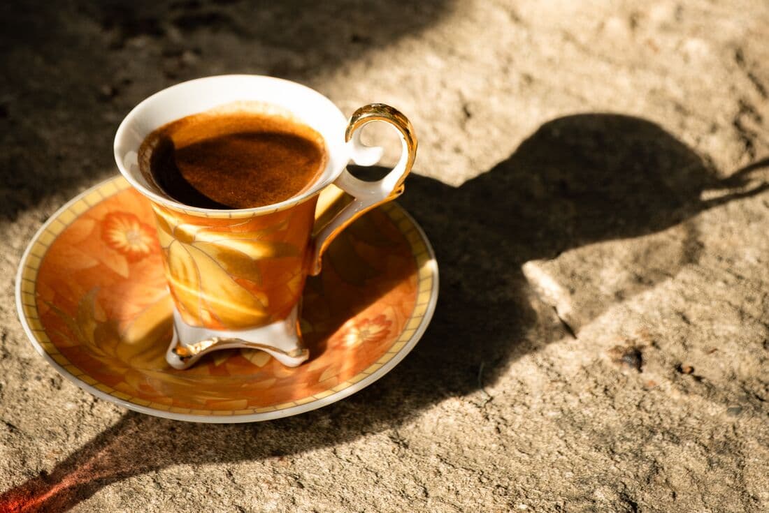 A ceramic cup of Albanian coffee made fresh in the Alps