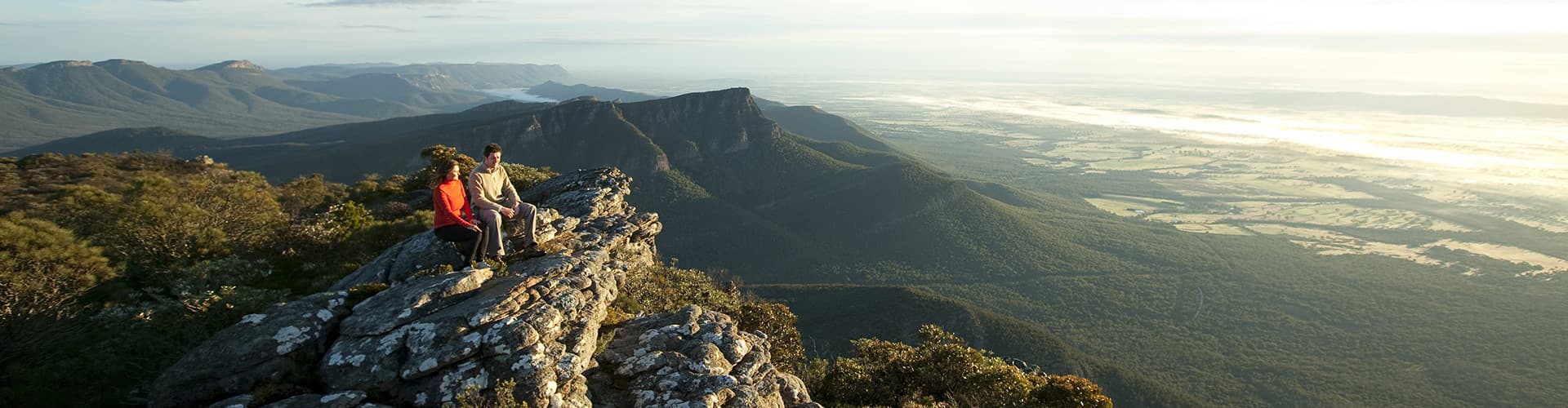 Travellers sitting on Baronia Peak in Grampians National Park, Victoria