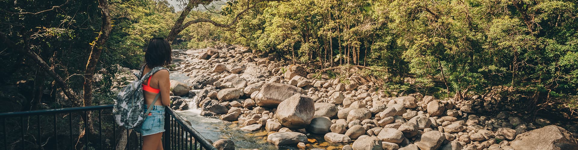 Woman overlooking Mossman gorge national park in far north Queensland