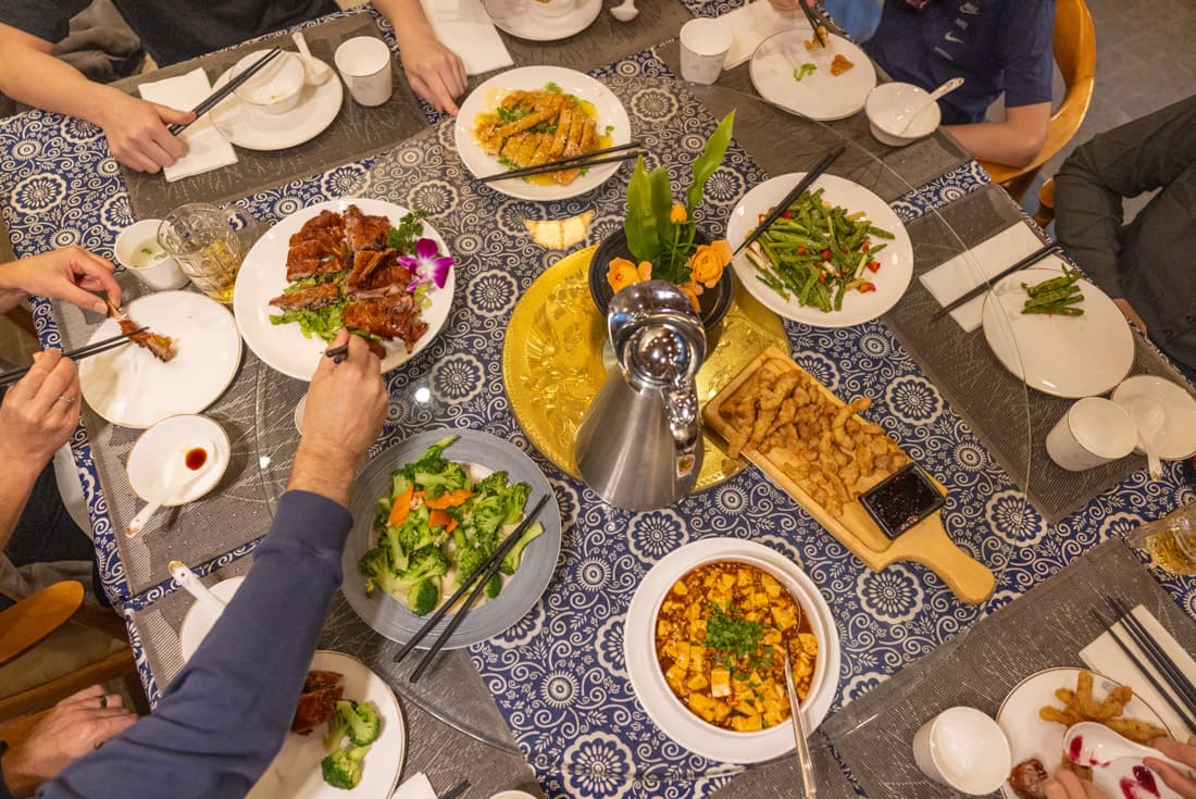 Array of dishes on a rotating table center in Chengdu China