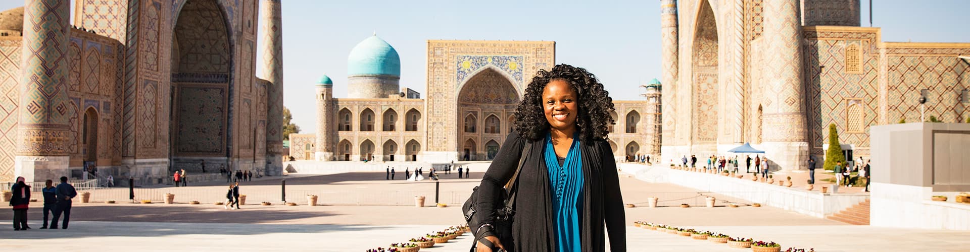 KFPU - Pax smiling in front of Registan Square in Samarkand, Uzbekistan
