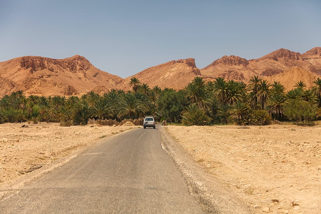 4WD on route in Landscape of Chebika oasis in Sahara desert, Tozeur, Tunisia