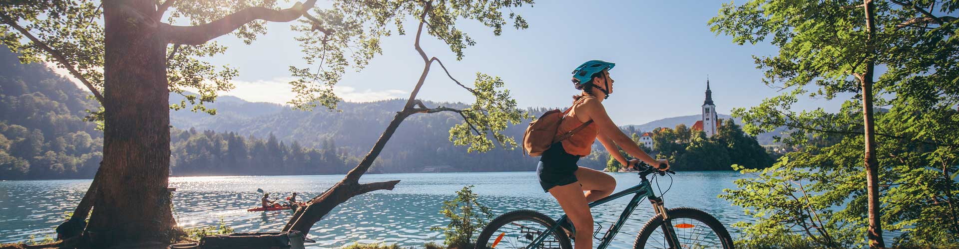 Traveller rides bike around Lake Bled
