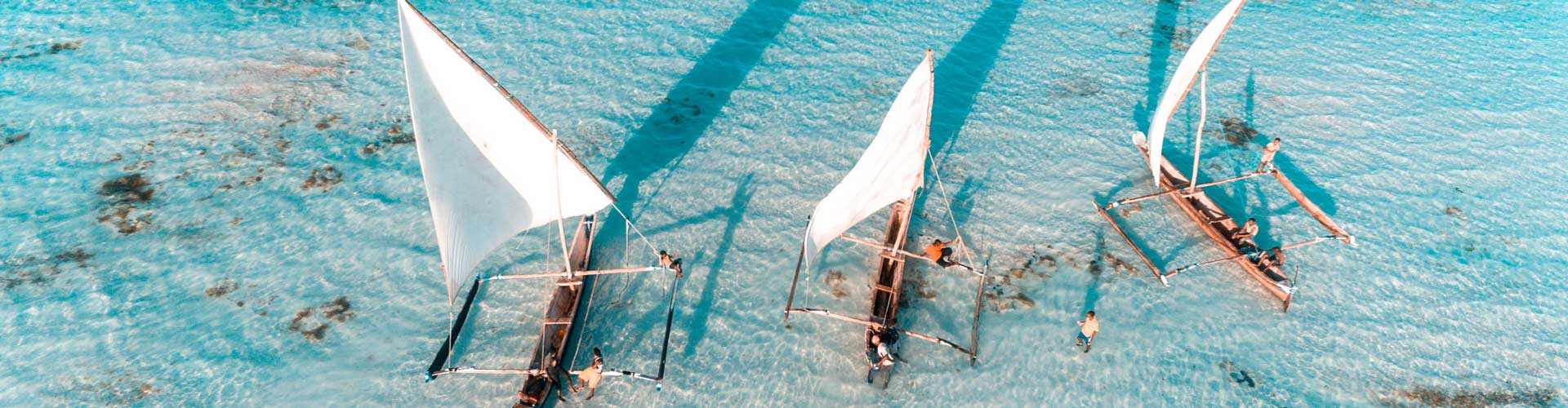 Aerial view of fisherman on the clear waters of Zanzibar