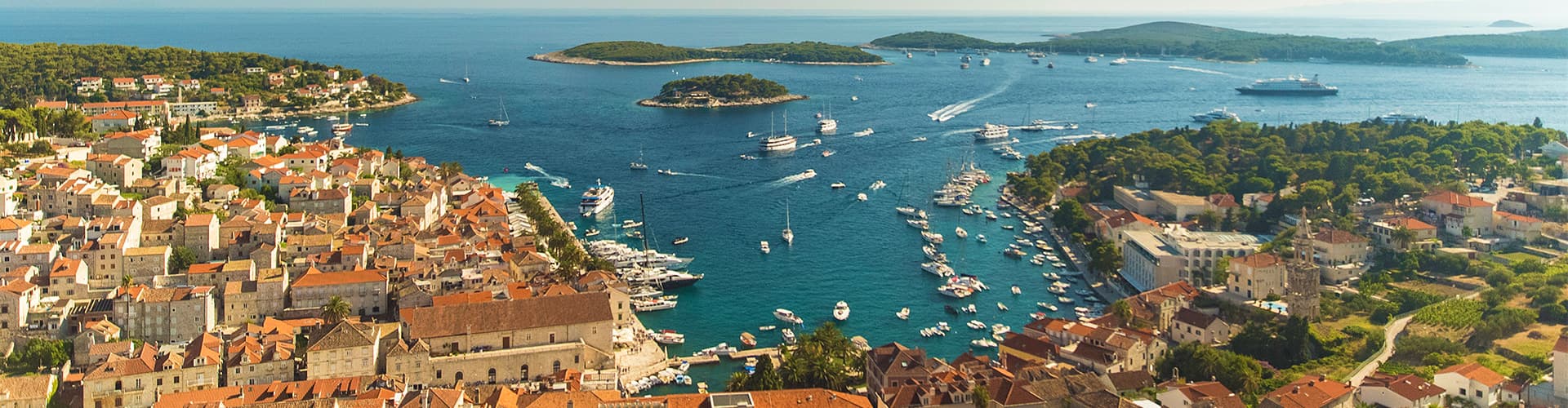 Aerial drone shot view of sailing boats cruising the Dalmatian Coast, Croatia
