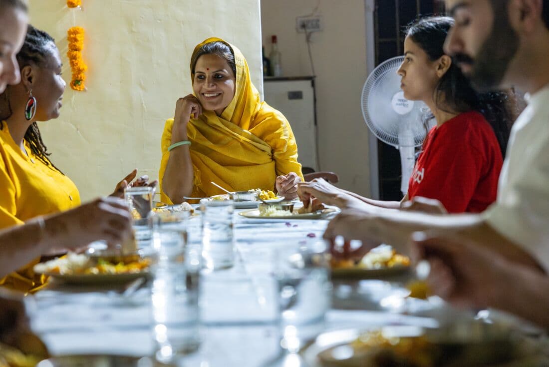 A chat with your chef after a home cooking class in Jaipur