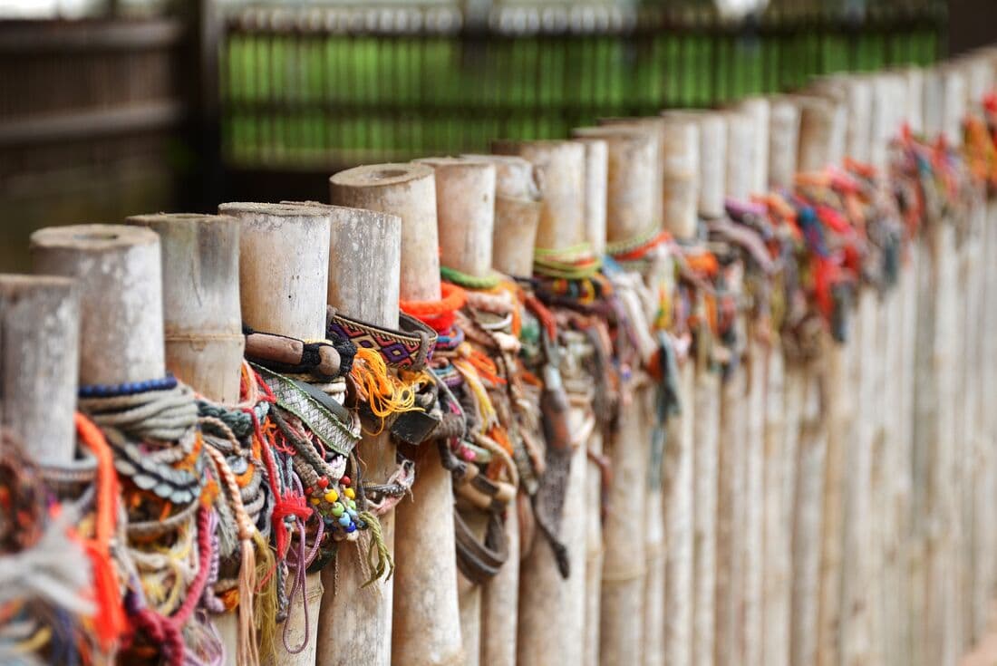Bracelets left by travellers throughout years at the Killing Fields of Choeung Ek mass grave