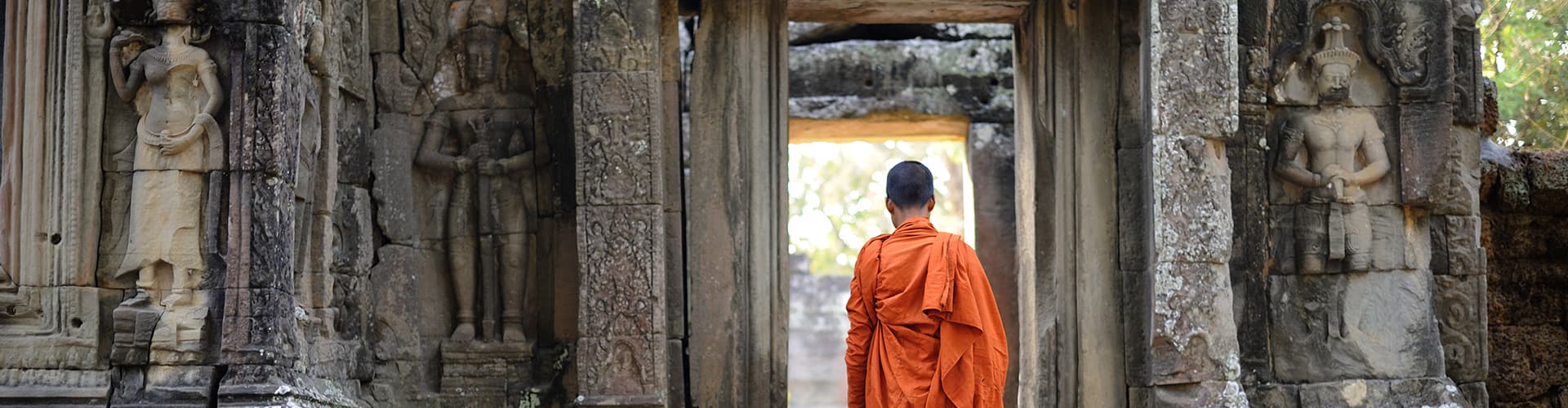 cambodia angkor temple monk walking doorway