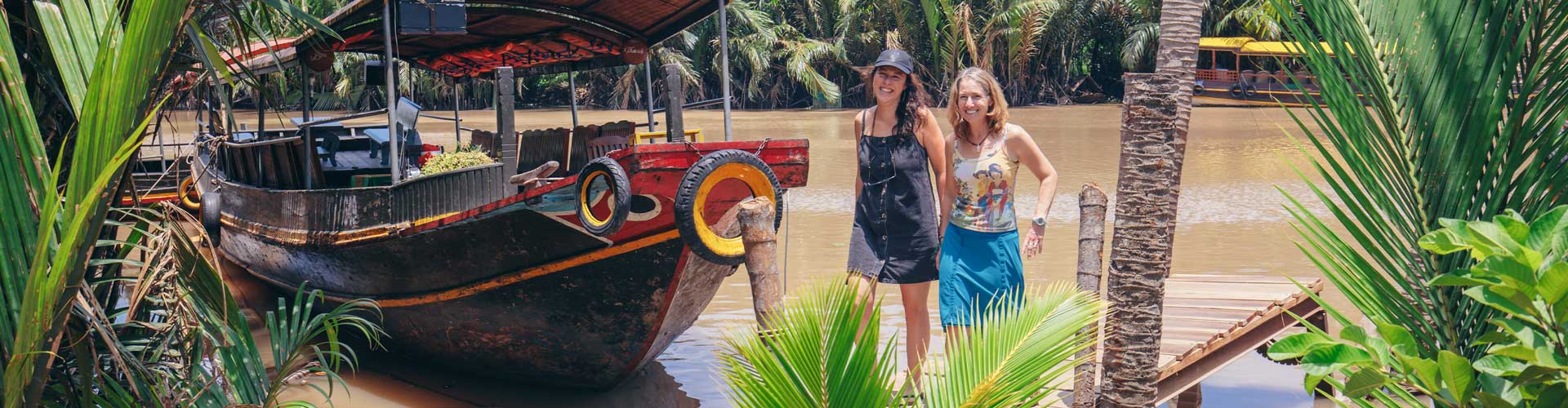 Travellers get ready to board boat on the mekong
