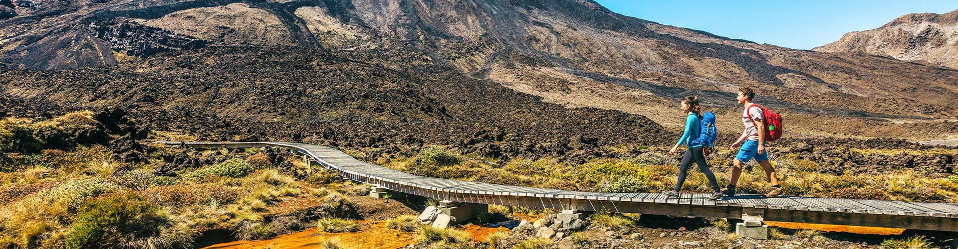 Travellers about to ascend the trail up Tongariro Crossing, North Island, New Zealand