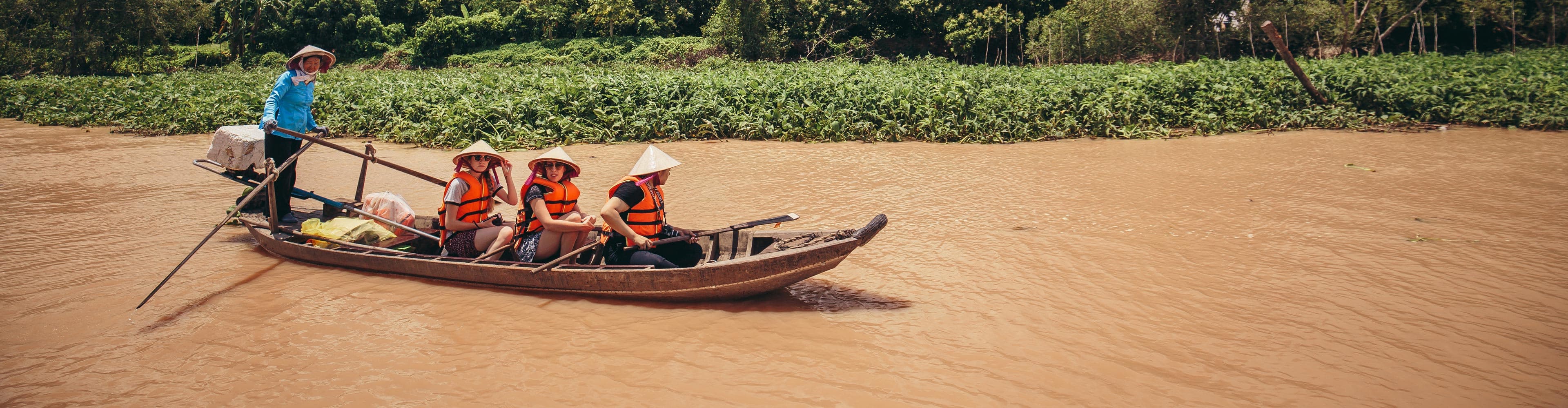 gteac_vietnam_mekong-river_canoe_smiling-pax_banner