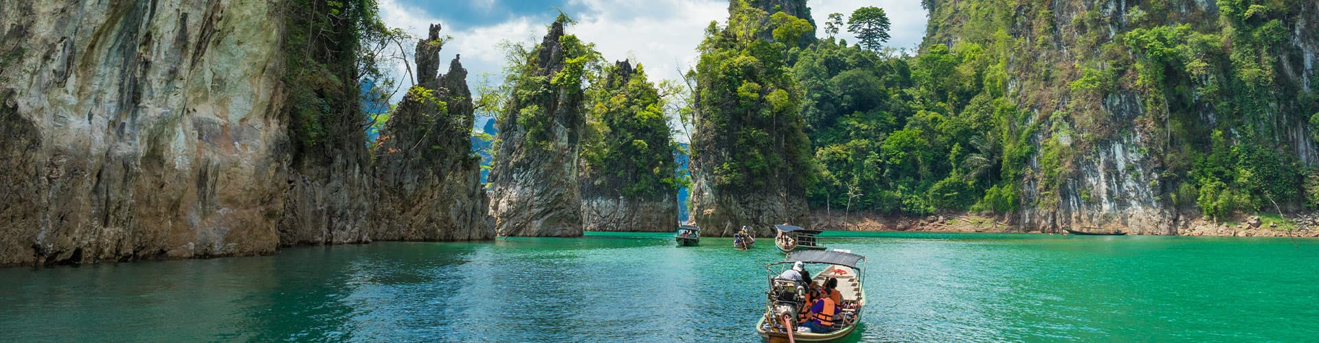Travellers cruising through Khao Sok by boat
