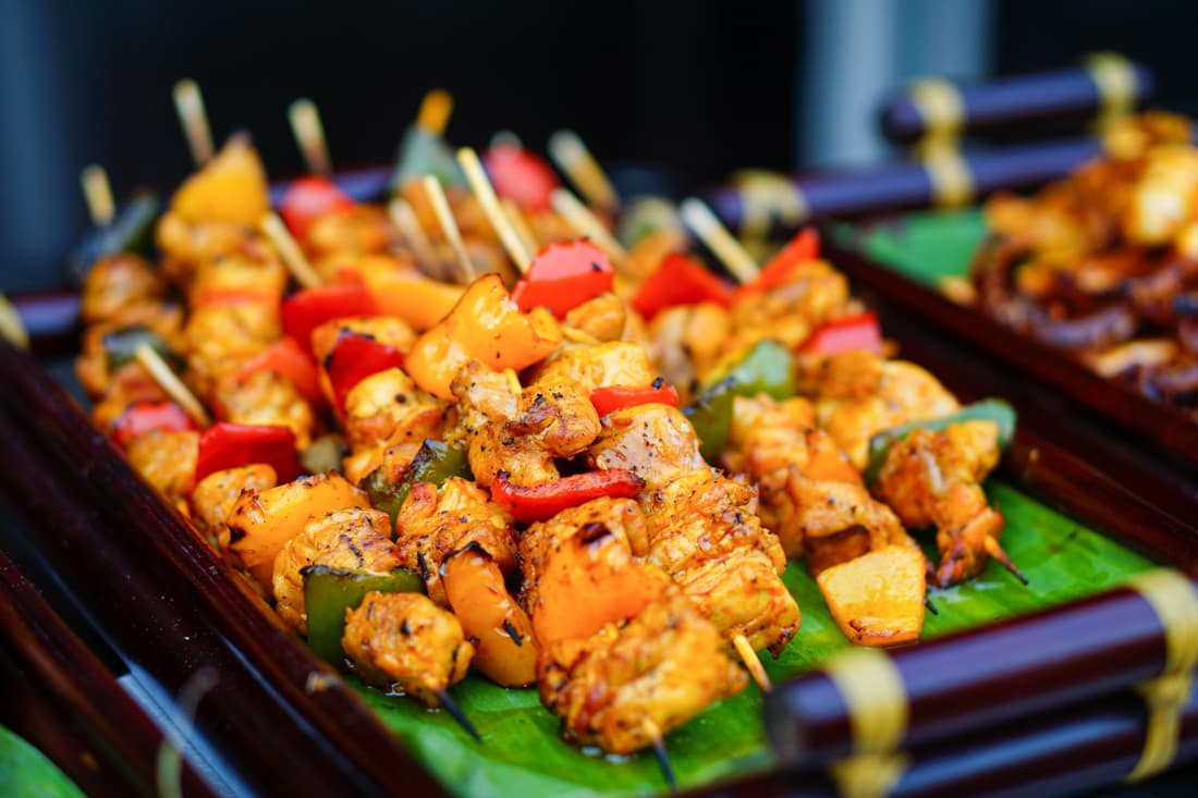 Barbeque street food in Sapa with fresh vegetables, flavourful chicken on skewers